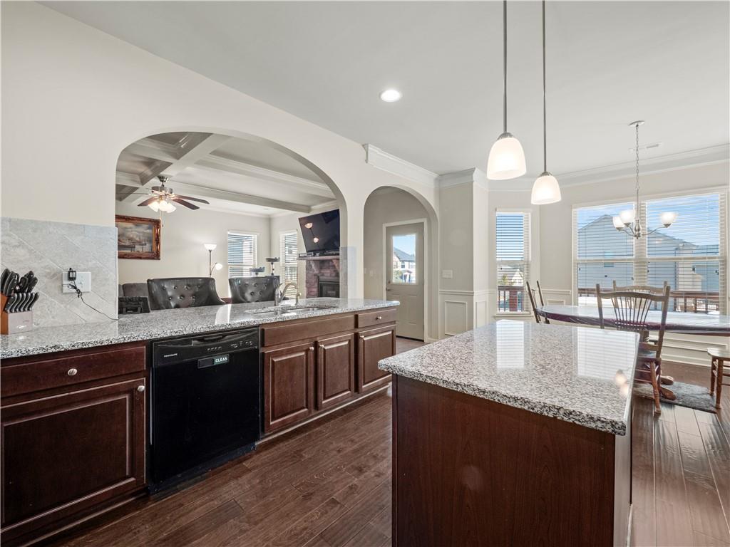 190 Silver Ridge Road Covington, GA 30016 - Photo 15 of 51 a large kitchen with granite countertop a sink a counter space appliances and cabinets