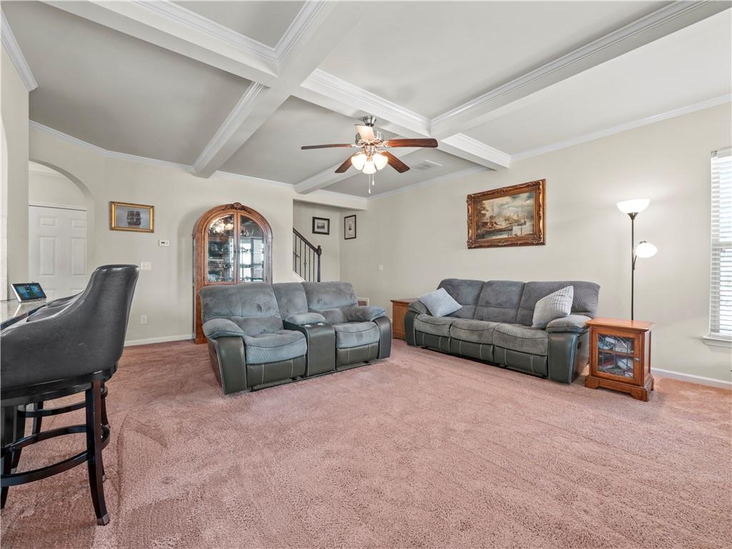 190 Silver Ridge Road Covington, GA 30016 - Photo 16 of 51 a living room with furniture and a chandelier