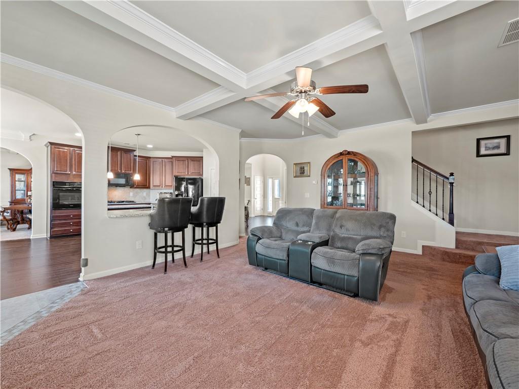 190 Silver Ridge Road Covington, GA 30016 - Photo 17 of 51 a living room with furniture a fireplace and a ceiling fan