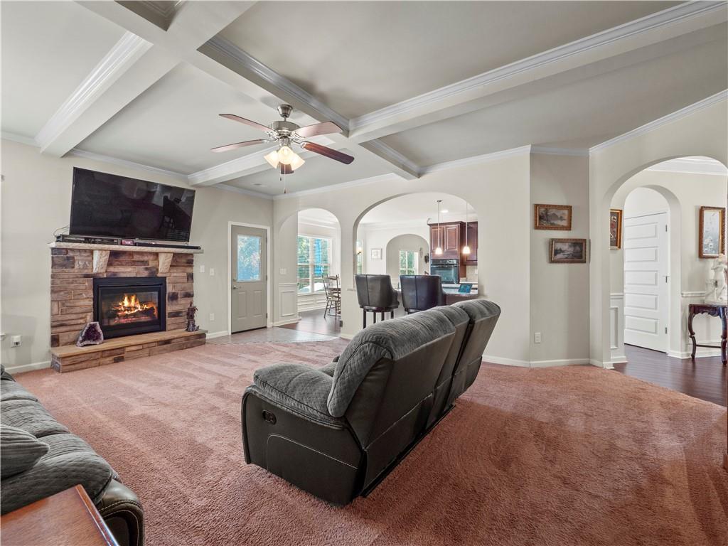 190 Silver Ridge Road Covington, GA 30016 - Photo 18 of 51 a living room with furniture a fireplace and a flat screen tv