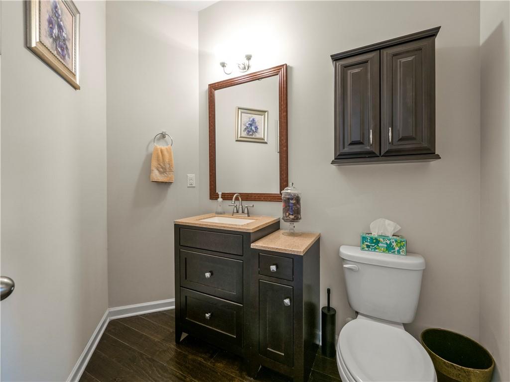 190 Silver Ridge Road Covington, GA 30016 - Photo 19 of 51 a bathroom with a toilet a sink and mirror
