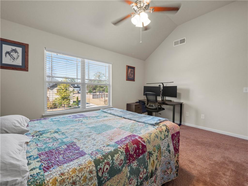 190 Silver Ridge Road Covington, GA 30016 - Photo 20 of 51 a bedroom with a bed and a window