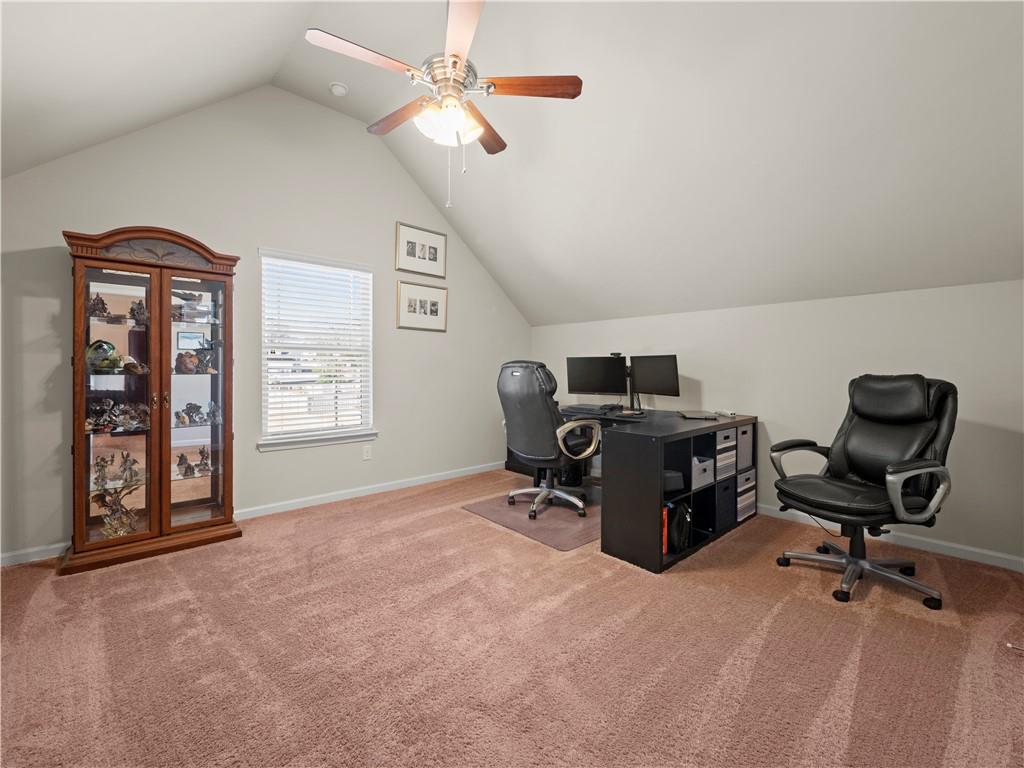 190 Silver Ridge Road Covington, GA 30016 - Photo 22 of 51 a view of a workspace with furniture and a window