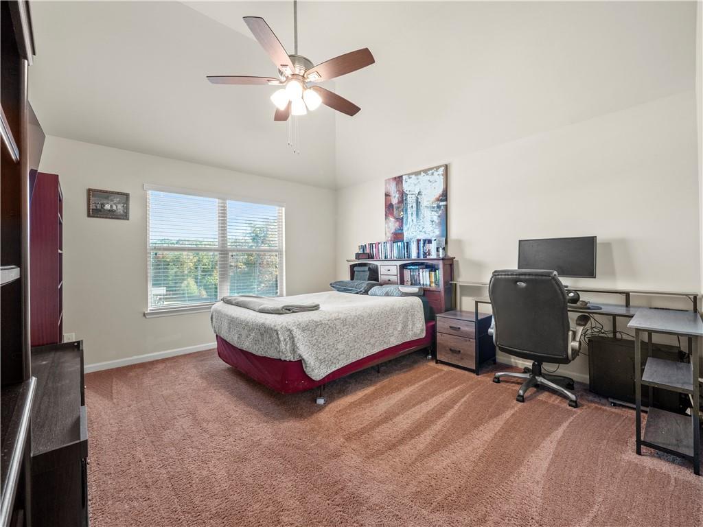 190 Silver Ridge Road Covington, GA 30016 - Photo 24 of 51 a spacious bedroom with a bed and a window