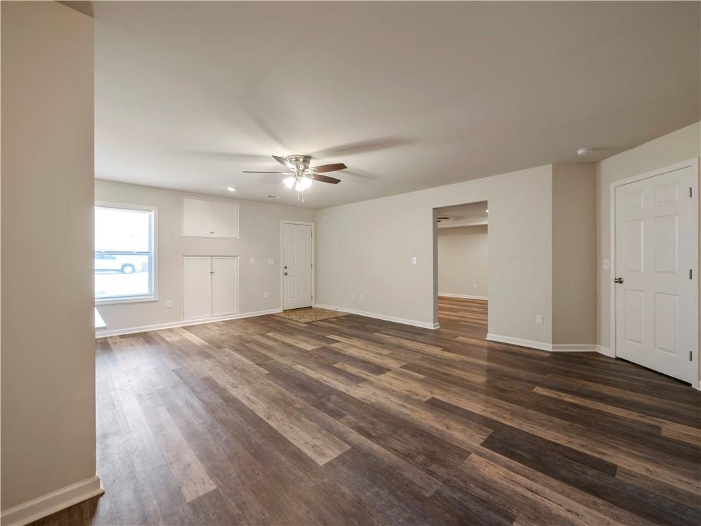 190 Silver Ridge Road Covington, GA 30016 - Photo 41 of 51 a view of empty room with wooden floor and fan