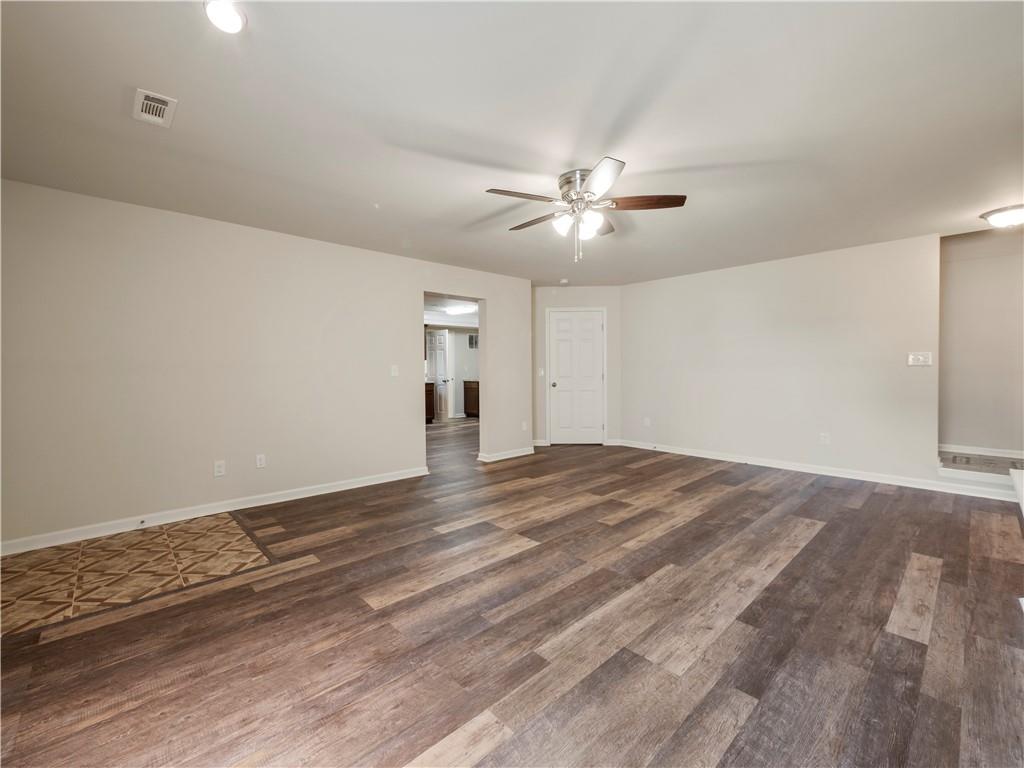 190 Silver Ridge Road Covington, GA 30016 - Photo 43 of 51 a view of empty room with wooden floor and fan
