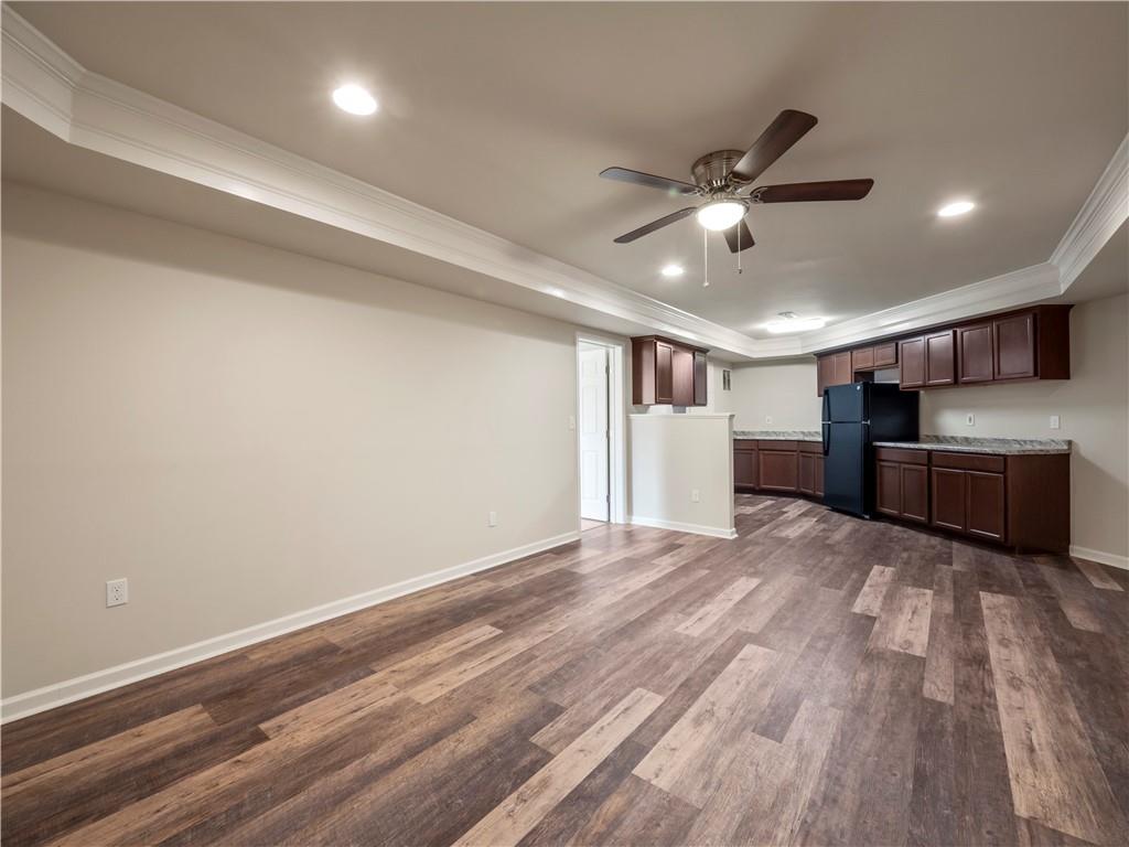 190 Silver Ridge Road Covington, GA 30016 - Photo 44 of 51 a view of empty room with wooden floor and ceiling fan
