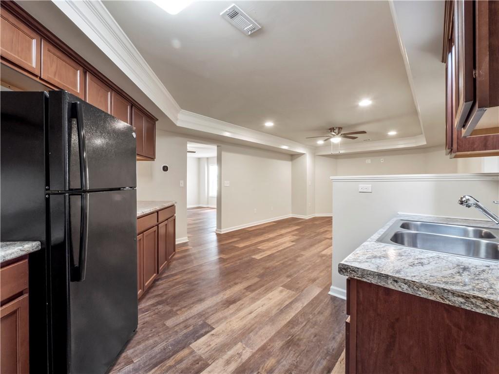 190 Silver Ridge Road Covington, GA 30016 - Photo 46 of 51 a kitchen with a sink and refrigerator