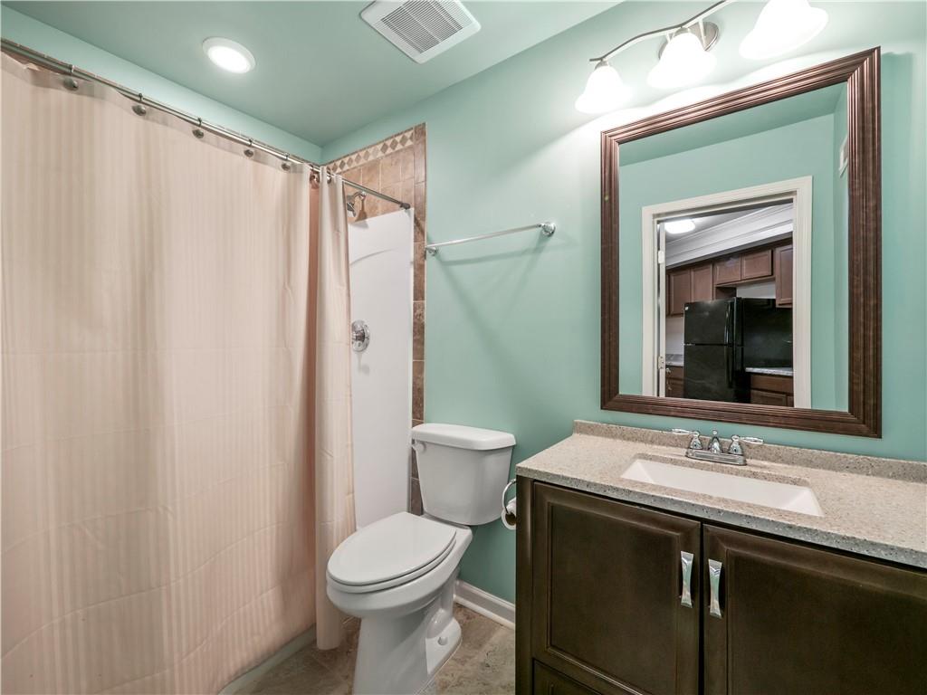 190 Silver Ridge Road Covington, GA 30016 - Photo 47 of 51 a bathroom with a sink a toilet and shower