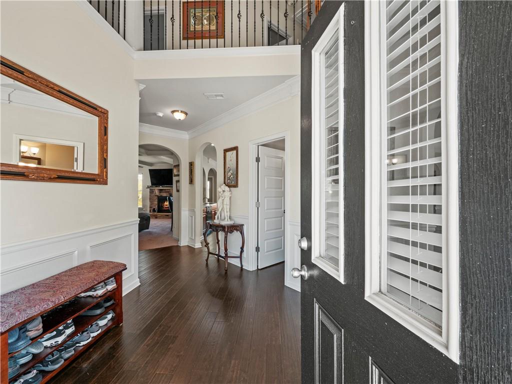 190 Silver Ridge Road Covington, GA 30016 - Photo 8 of 51 a view of a hallway with wooden floor and furniture