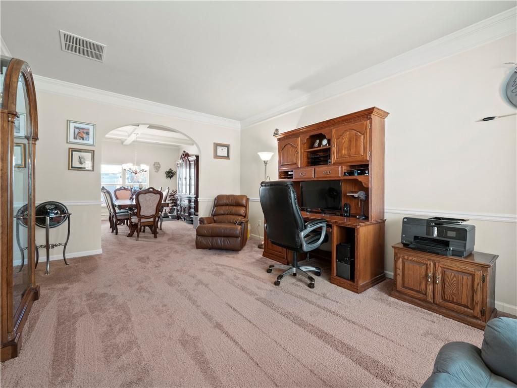 190 Silver Ridge Road Covington, GA 30016 - Photo 10 of 51 a view of a livingroom with workspace and a couch
