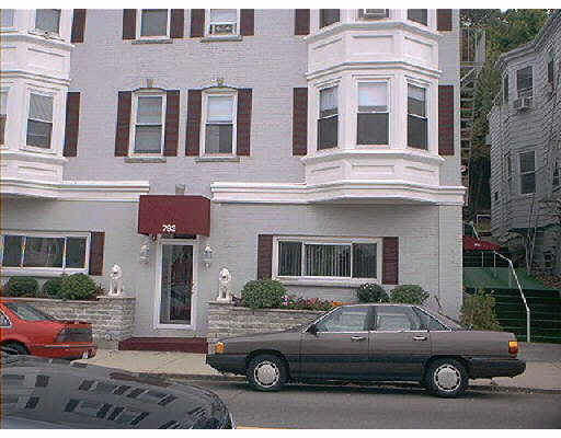 793 Main Street, Unit 8 Malden, MA 02148 - Photo 1 of 1 a car parked in front of a building