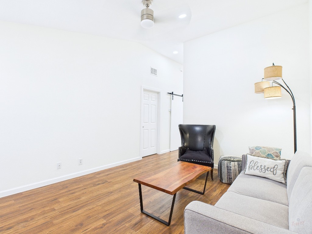 2216 San Gabriel Street, Unit 305 Austin, TX 78705 - Photo 13 of 38 a living room with furniture and wooden floor