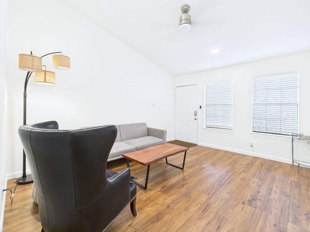 2216 San Gabriel Street, Unit 305 Austin, TX 78705 - Photo 14 of 38 a living room with furniture and a wooden floor