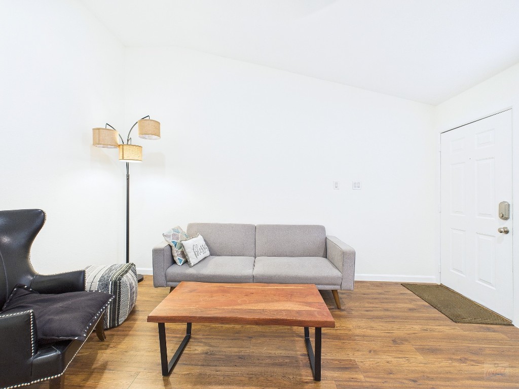 2216 San Gabriel Street, Unit 305 Austin, TX 78705 - Photo 15 of 38 a living room with furniture and a wooden floor