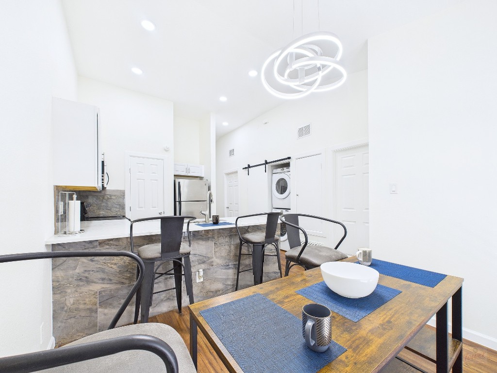 2216 San Gabriel Street, Unit 305 Austin, TX 78705 - Photo 2 of 38 a view of a dining room with furniture