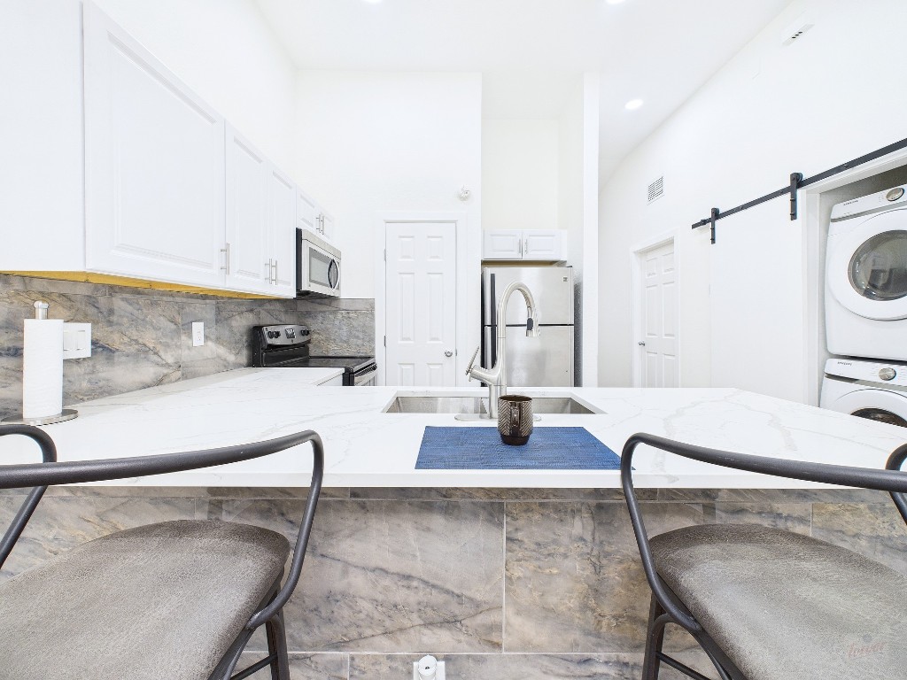 2216 San Gabriel Street, Unit 305 Austin, TX 78705 - Photo 6 of 38 a living room with furniture and a table