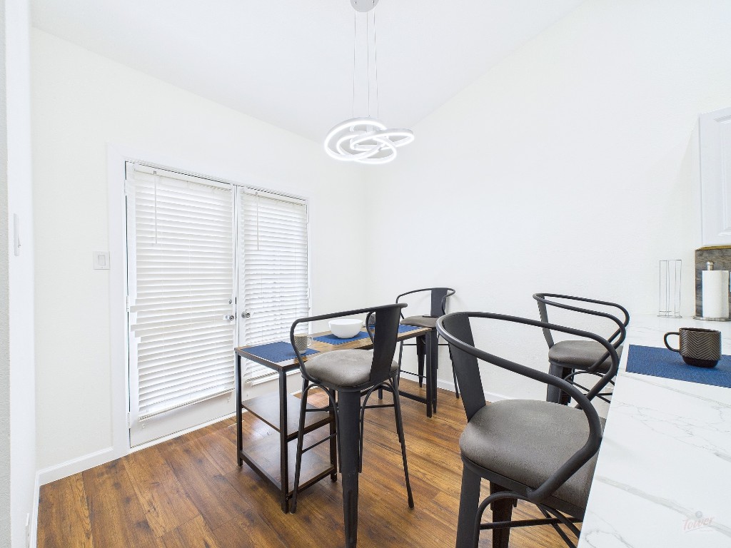 2216 San Gabriel Street, Unit 305 Austin, TX 78705 - Photo 8 of 38 a view of a room with furniture and wooden floor