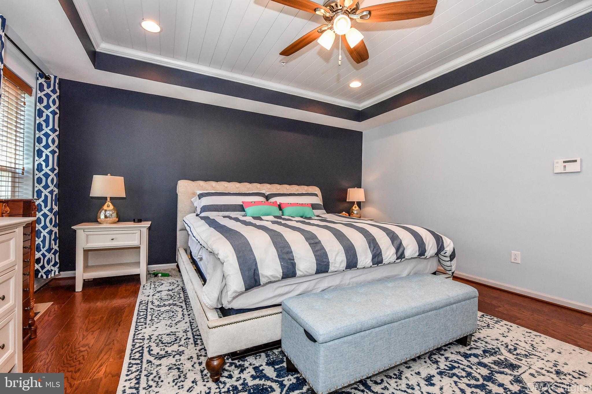 6860 East Shavano Road New Market, MD 21774 - Photo 22 of 45 Stunning primary bedroom with accent wall.