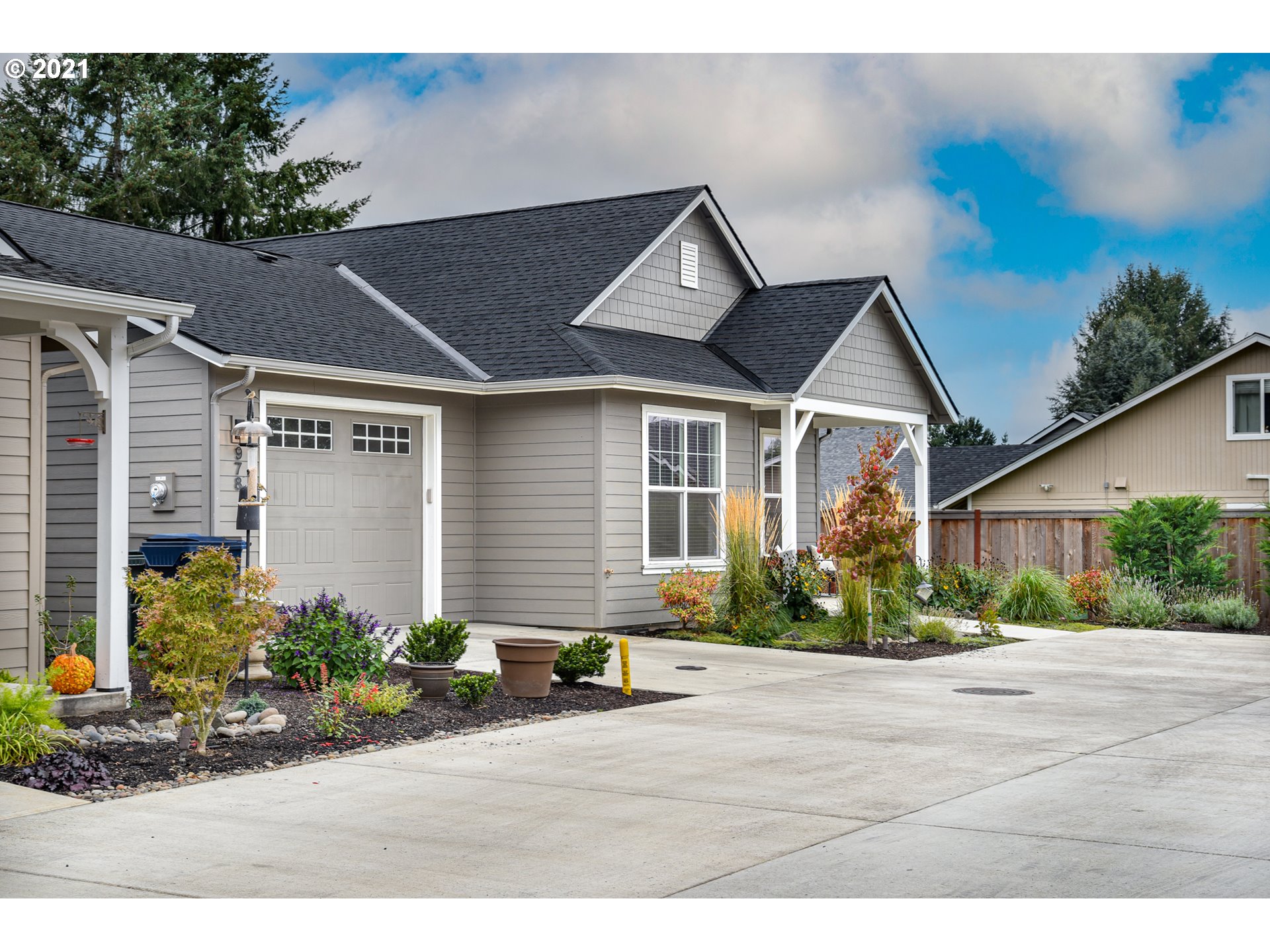 978 South 47th Street Springfield, OR 97478 - Photo 5 of 32 a front view of a house with a yard and outdoor seating
