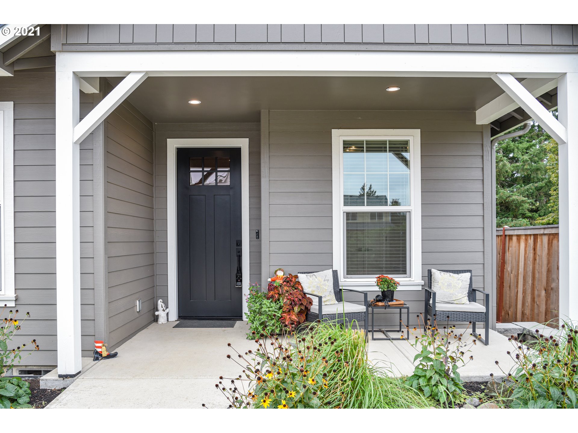 978 South 47th Street Springfield, OR 97478 - Photo 6 of 32 a backyard of a house with table and chairs