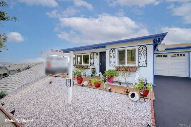 a front view of a house with an outdoor space