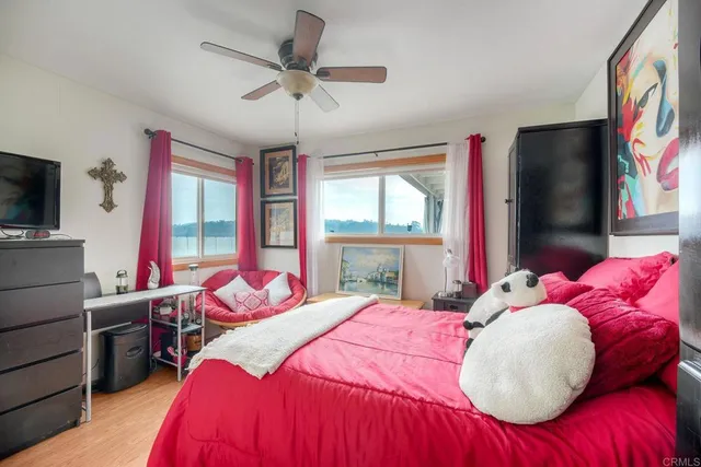 a dining room with furniture and a rug