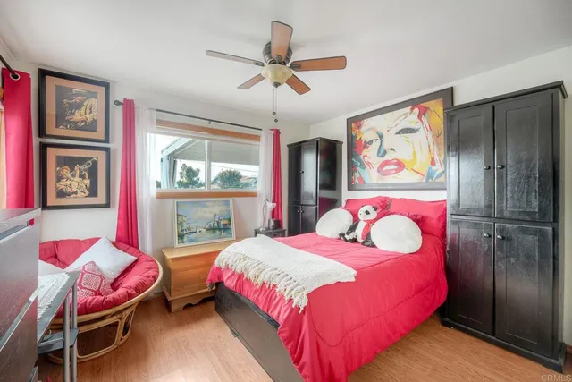a dining room with furniture and a floor to ceiling window