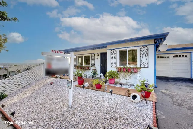 a house view with a garden space