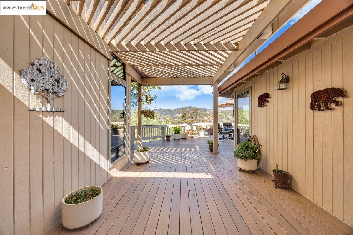 13700 Clements Road Groveland, CA 95321 - Photo 59 of 93 Wooden deck featuring a mountain view and outdoor dining space