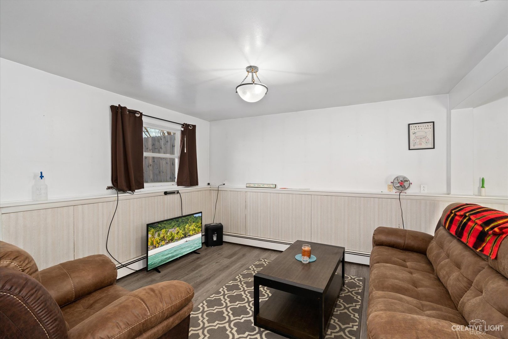 232 Reid Road Genoa, IL 60135 - Photo 13 of 25 a living room with furniture and a flat screen tv