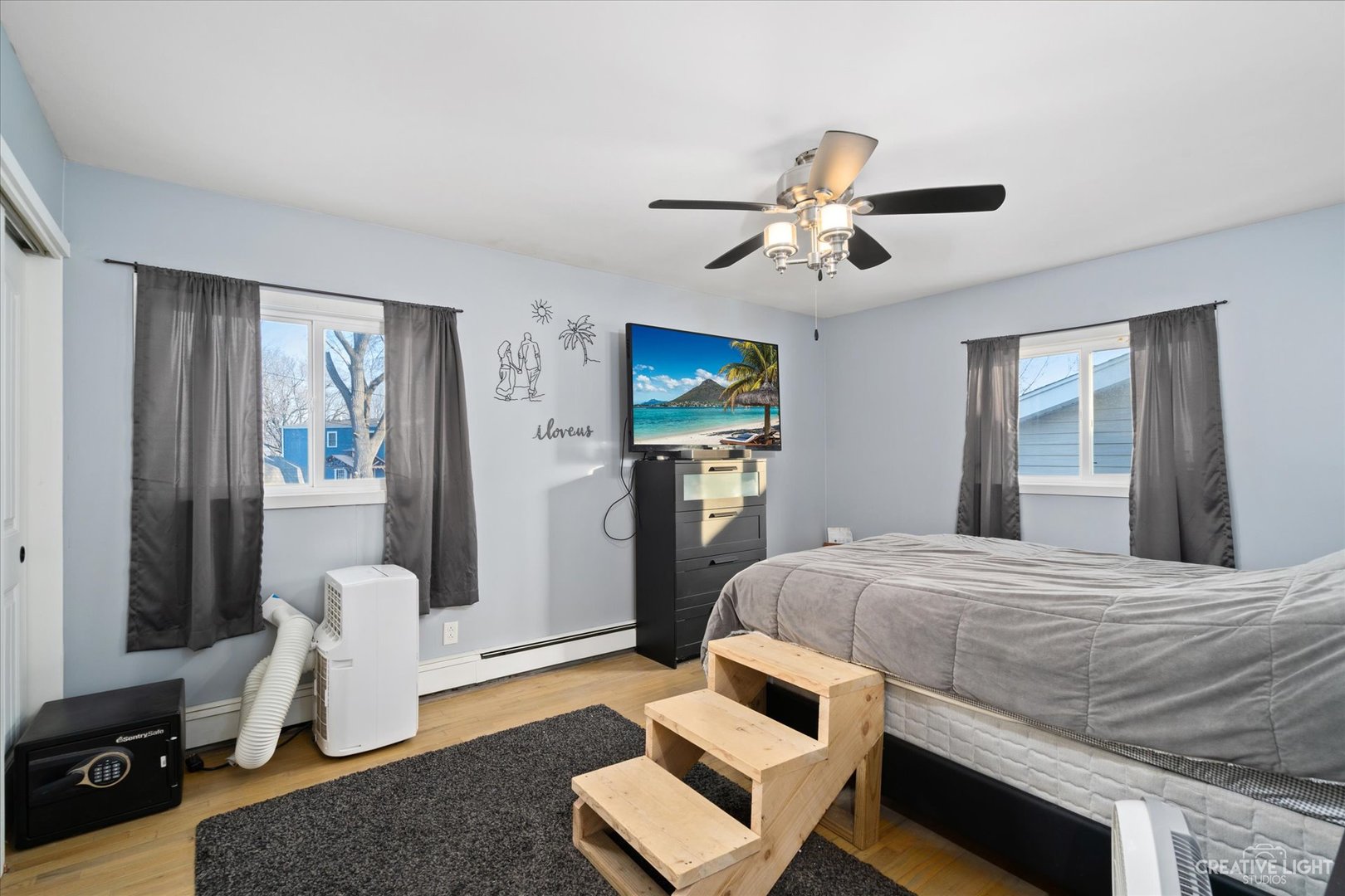 232 Reid Road Genoa, IL 60135 - Photo 14 of 25 a bedroom with a bed and a couch