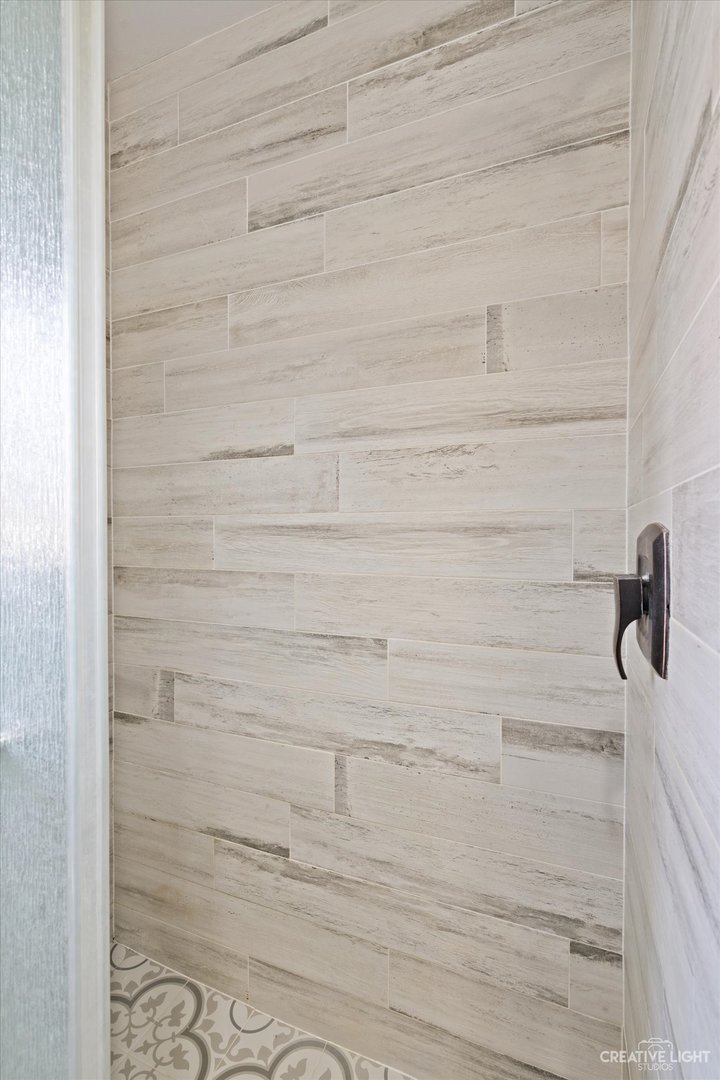 232 Reid Road Genoa, IL 60135 - Photo 17 of 25 a bathroom with a shower