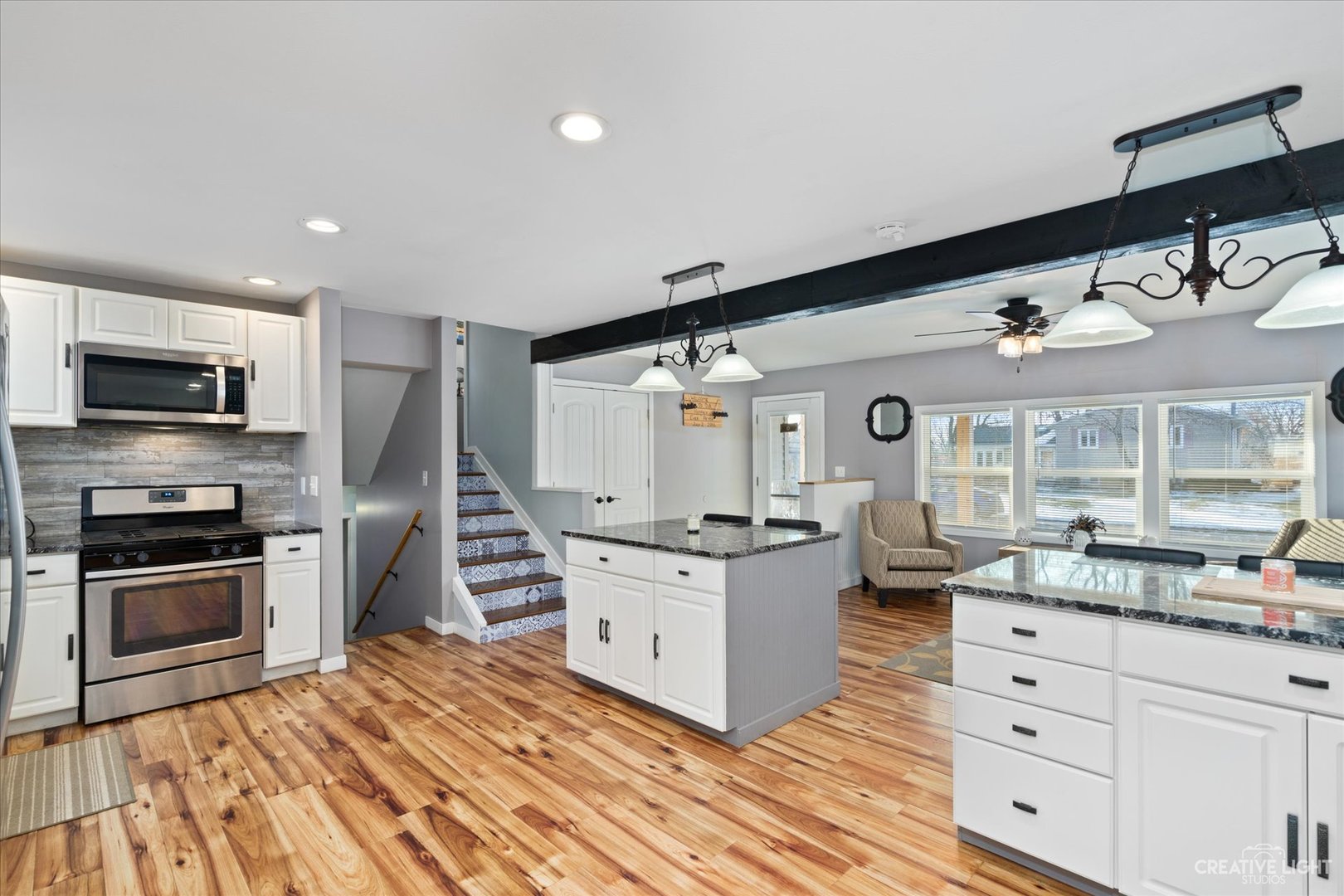 232 Reid Road Genoa, IL 60135 - Photo 6 of 25 a kitchen with granite countertop a sink and a stove top oven