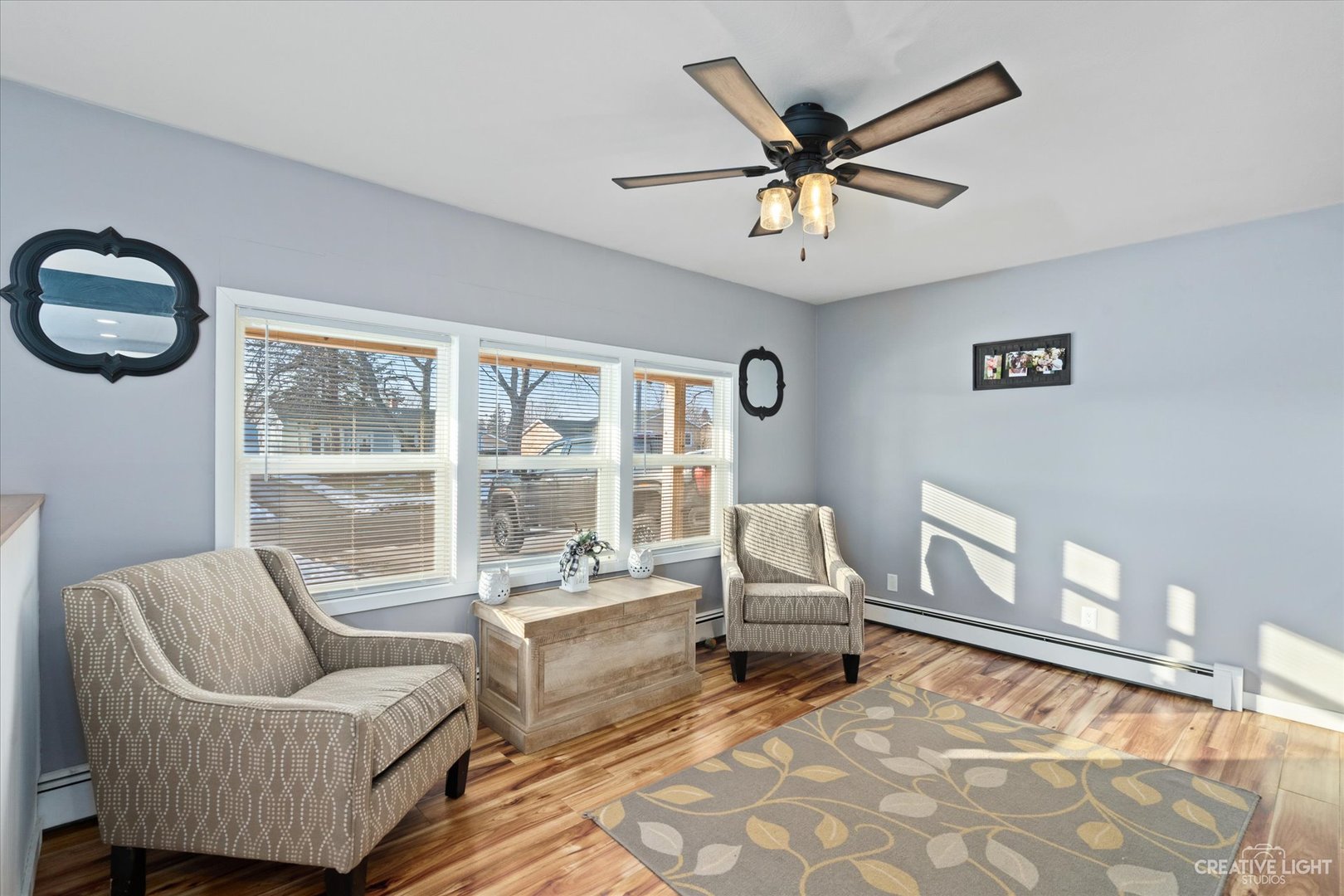 232 Reid Road Genoa, IL 60135 - Photo 9 of 25 a living room with furniture and a large window