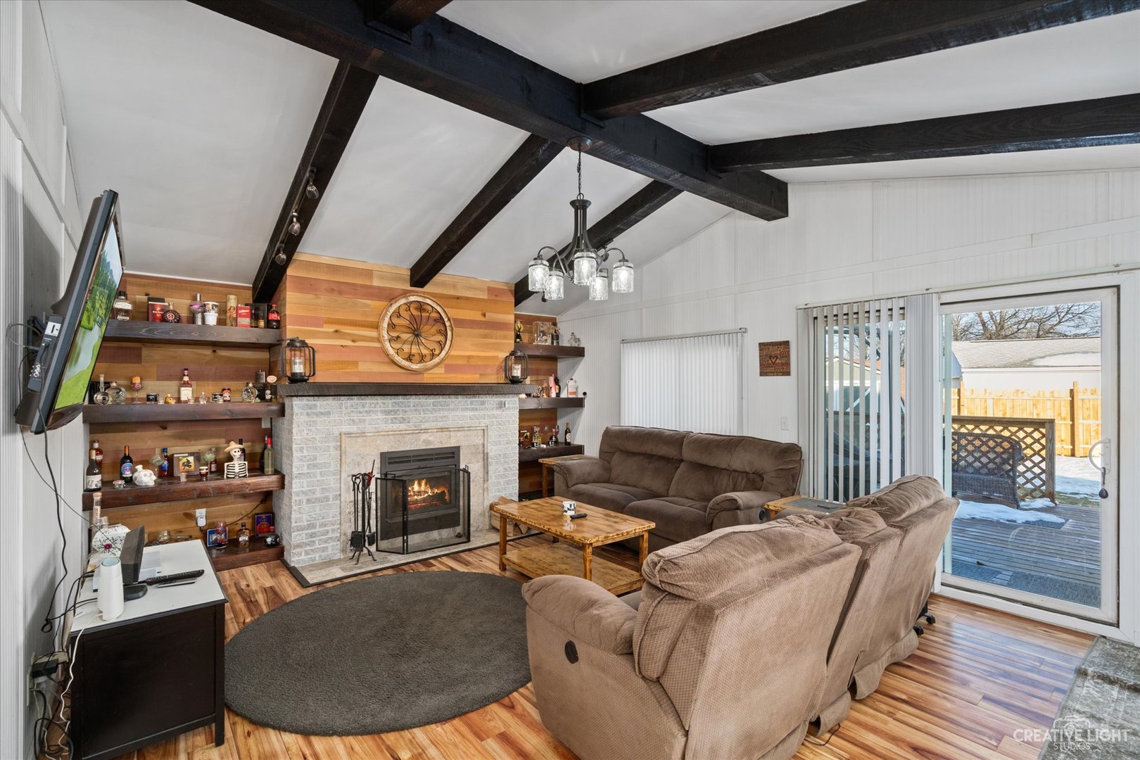 232 Reid Road Genoa, IL 60135 - Photo 10 of 25 a living room with furniture and a fireplace