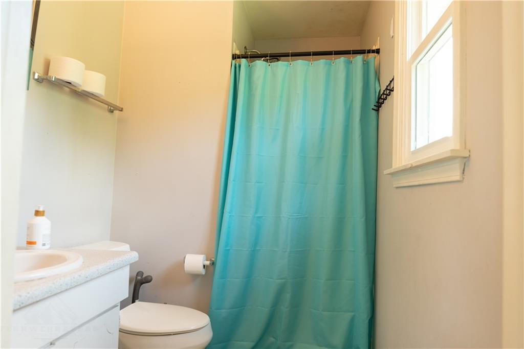 216 Ruth Drive Home, PA 15747 - Photo 12 of 15 a white toilet sitting next to a bathroom sink