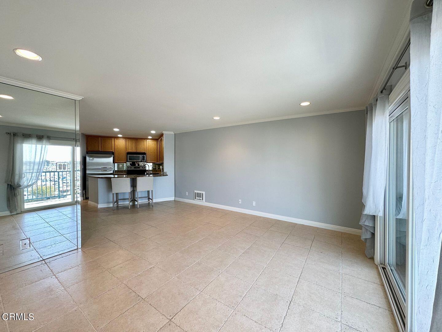 2901 Peninsula Road, Unit 348 Oxnard, CA 93035 - Photo 11 of 22 en empty room with furniture and a table