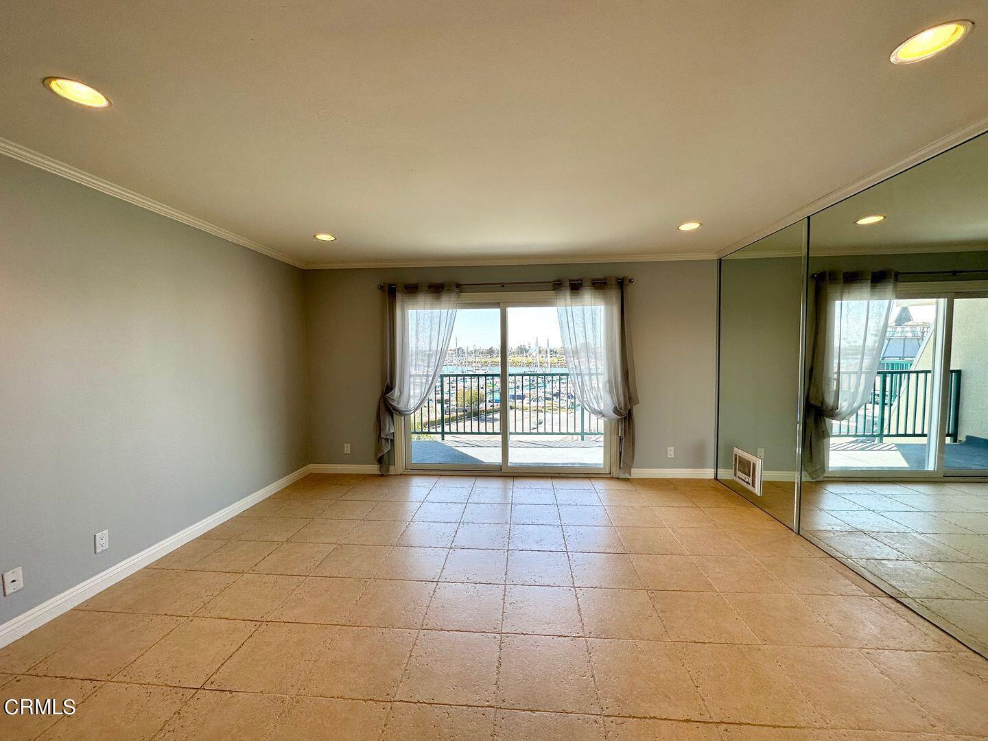 2901 Peninsula Road, Unit 348 Oxnard, CA 93035 - Photo 14 of 22 a view of an empty room with glass door