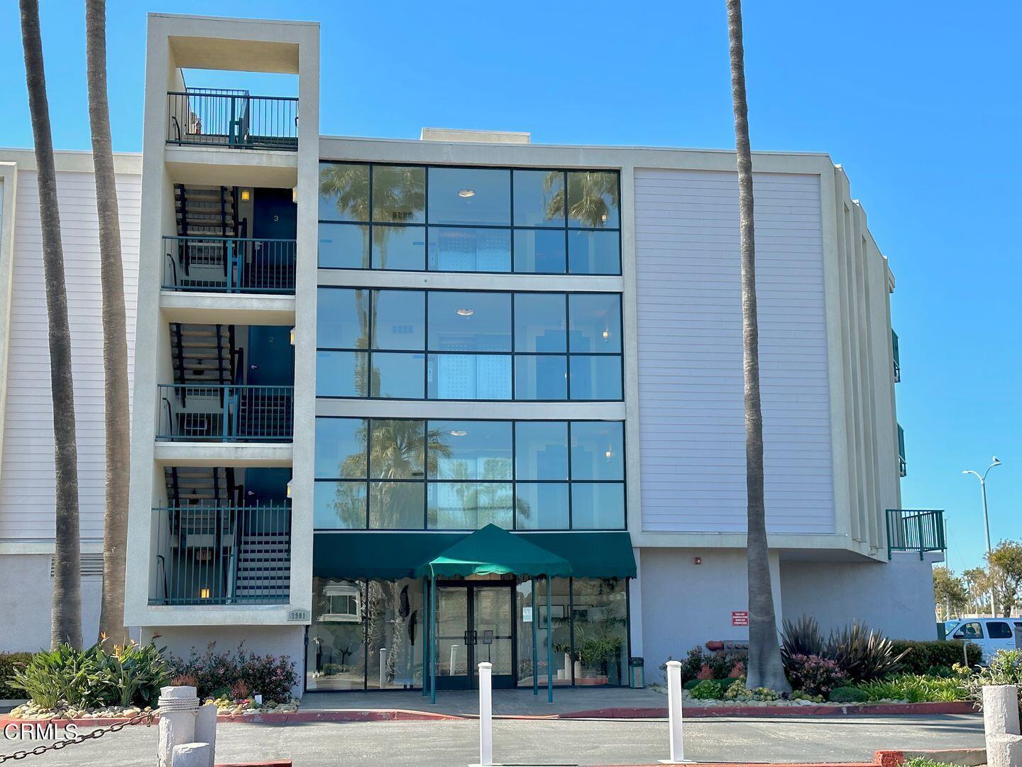 2901 Peninsula Road, Unit 348 Oxnard, CA 93035 - Photo 2 of 22 a front view of a building with a glass door