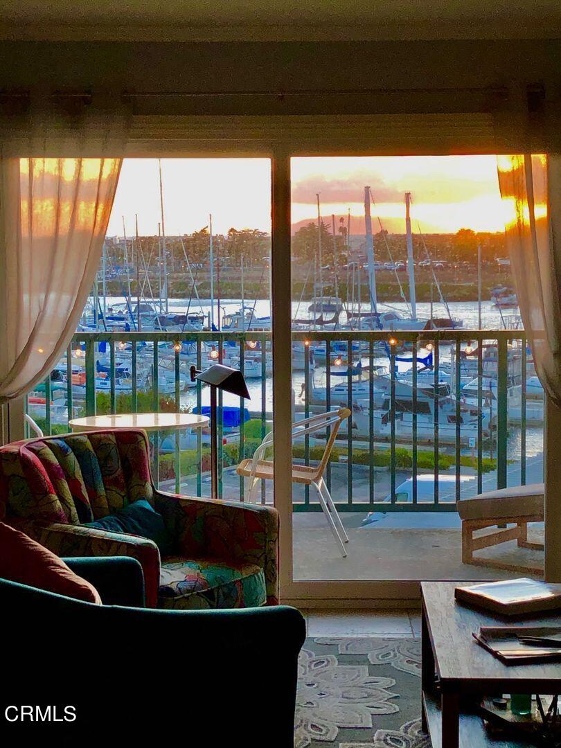 2901 Peninsula Road, Unit 348 Oxnard, CA 93035 - Photo 21 of 22 a living room with a large window and a table