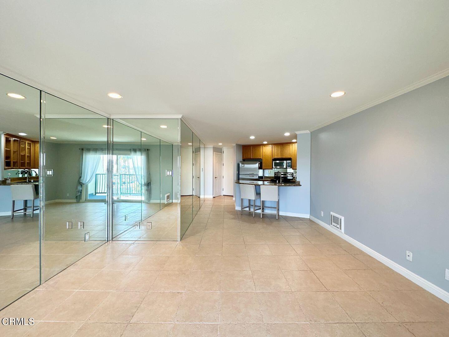 2901 Peninsula Road, Unit 348 Oxnard, CA 93035 - Photo 10 of 22 a living room with furniture and a flat screen tv