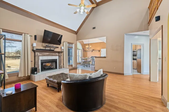 a living room with fireplace furniture and a flat screen tv