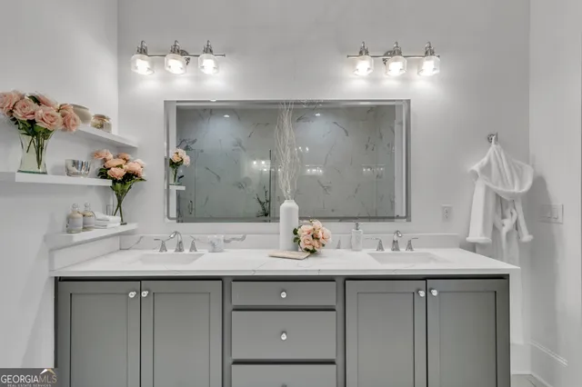 a bathroom with a sink vanity and a mirror
