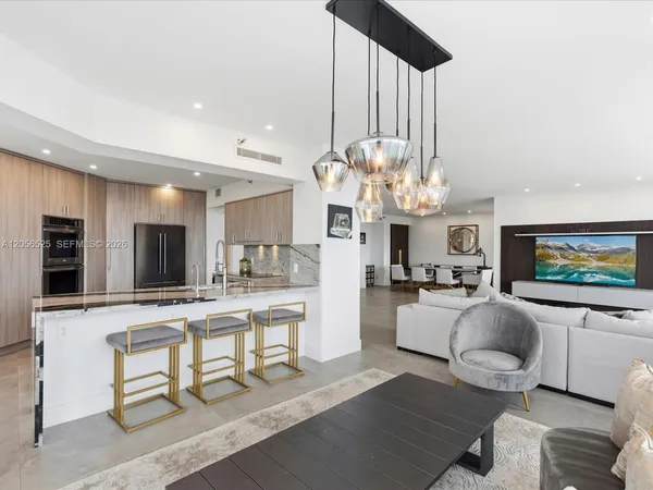 a living room with fireplace furniture and a flat screen tv