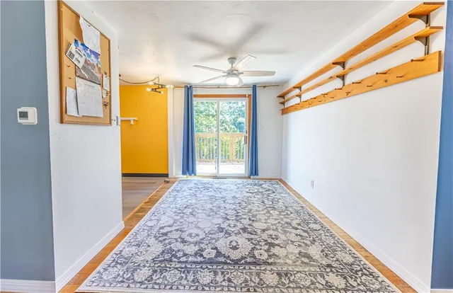 a view of hallway with window and chandelier
