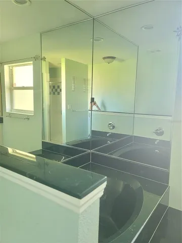 a bathroom with a sink a vanity and a mirror