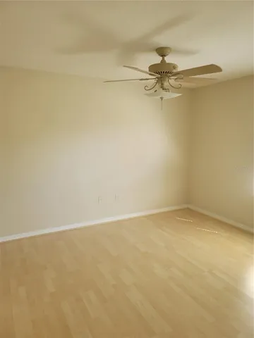 a bathroom with a granite countertop sink toilet a mirror and shower