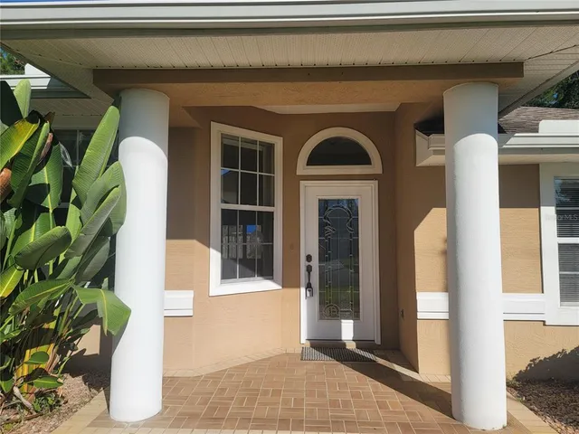 a front view of a house with a porch