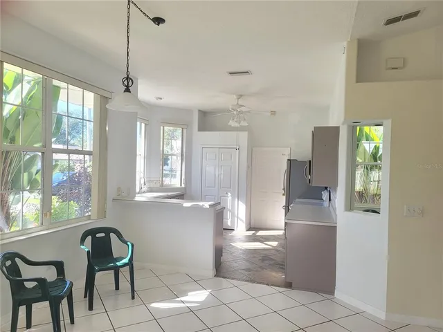 a view of a room with window and wooden floor